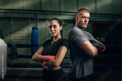 Portrait of two fighters, male and female.