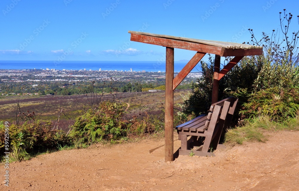 Picnic bench in a mountain looking at the beach