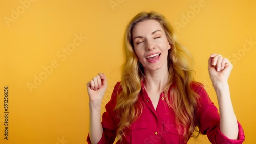 Wallpaper Mural Success, dancing and woman celebration winning, excited. Female model emotional having fun enjoying dance, smiling for freedom, discount, sale or entertainment in studio isolated on yellow background Torontodigital.ca