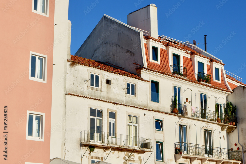 Classical vintage facades downtown at sunset Lisbon, Alfama district, Portugal