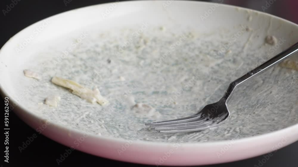 Empty plate after eating on table Empty plate after eating on table