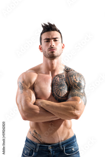 Handsome shirtless athletic man with arms crossed on muscular chest