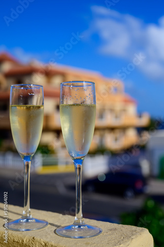 Dinner party, drinking of cava or champagne sparkling wine in vacation resort Caleta Fuste, Fuerteventura, Canary islands vacation, Spain