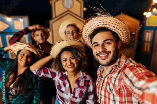 Festa Junina in Brazil. Group of friends taking a selfie during the Festa Junina.