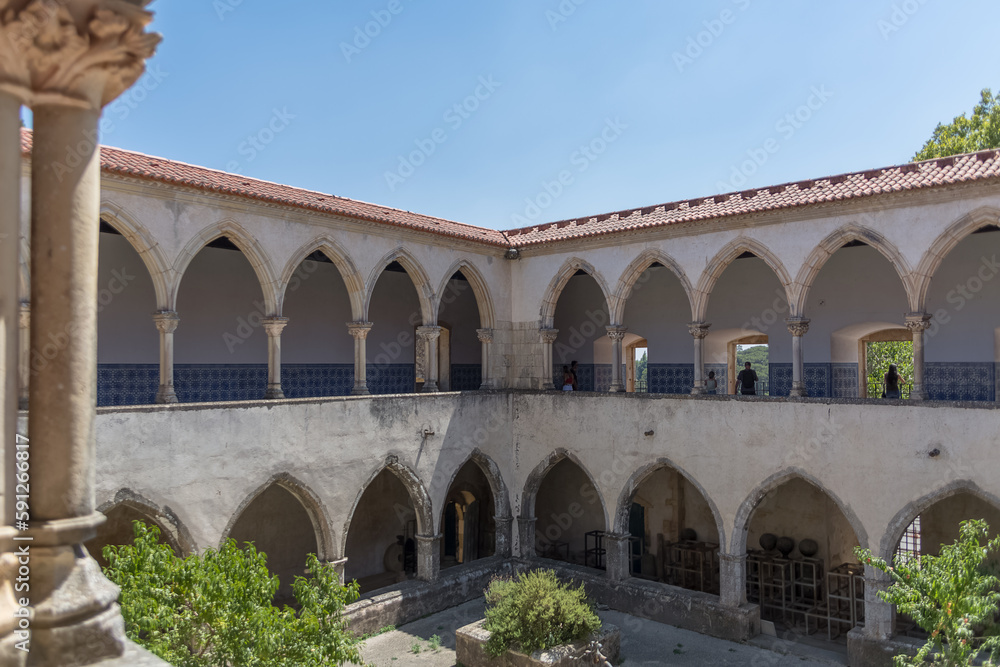 View at the ornamented romanesque wash cloister, or Claustro da Lavagem, an iconic piece of the Portuguese romanesque type, on Convent of Christ, Tomar
