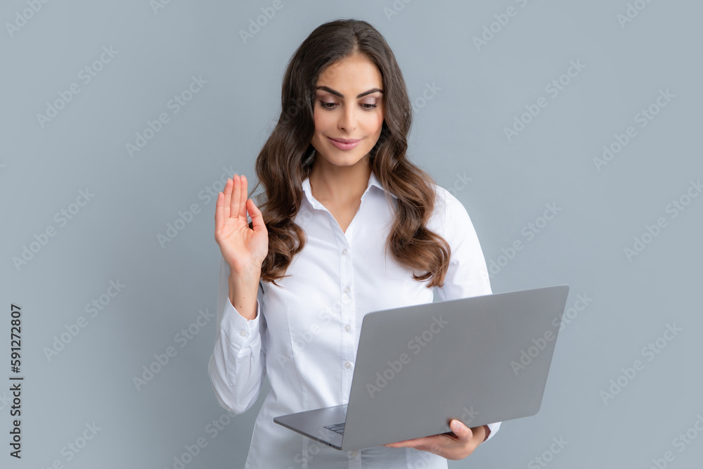 Portrait of positive cheerful ceo expert business woman work at laptop isolated over gray background. Secretary with laptop, studio portrait. Portrait of positive cheerful ceo expert business woman work at laptop isolated over gray background. Secretary with laptop, studio portrait.