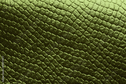 Gold green foil paper. Abstract reptile skin imitation texture background.