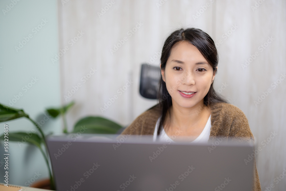 Housewife work on the laptop computer at home Housewife work on the laptop computer at home