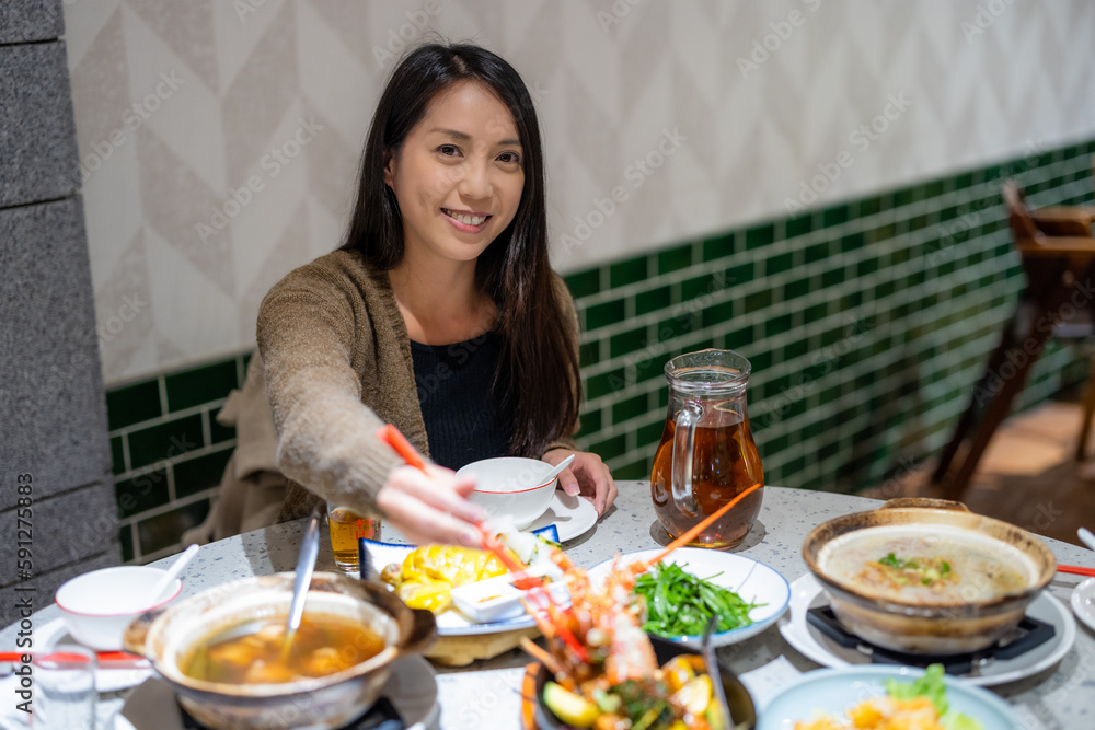 Woman enjoy the dinner in chinese restaurant Woman enjoy the dinner in chinese restaurant