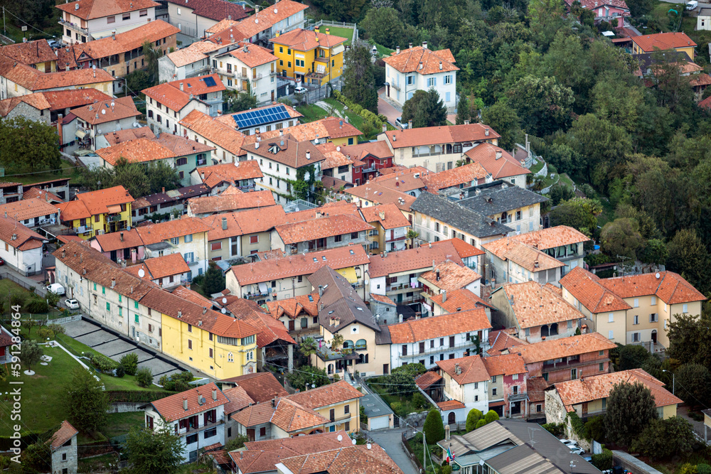 A bird's eye view of a village houses with a red roofs