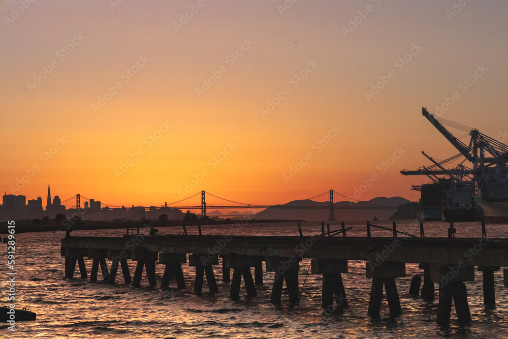 San Francisco Bay, the city and the Bay Bridge at sunset as seen from Alameda Island