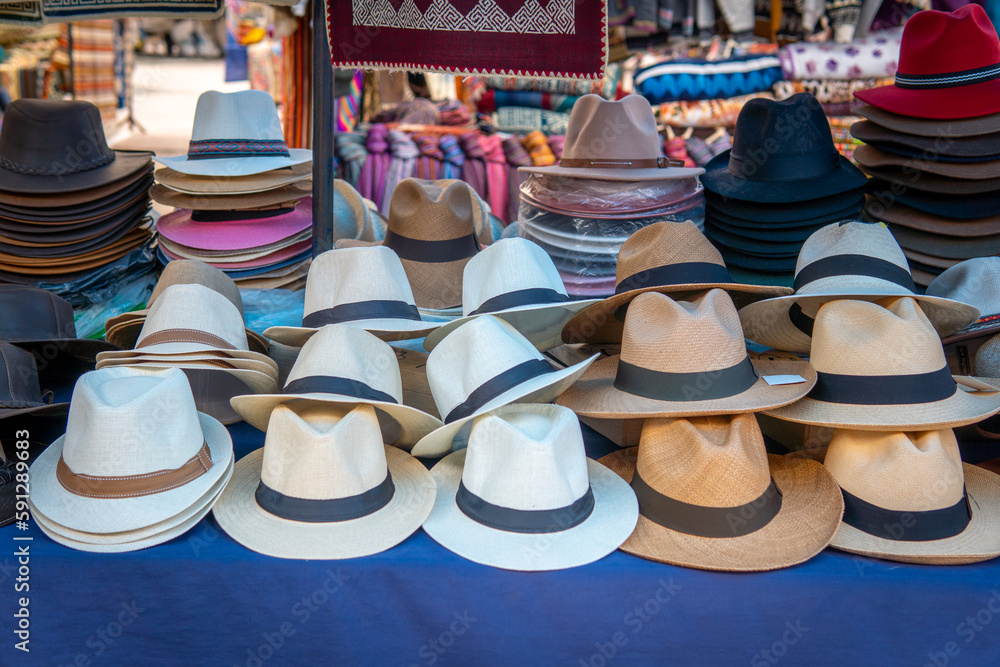Panama hats at a poncho market stall in Otavalo