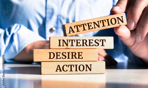 Obraz na plátně Close up on businessman holding a wooden block with attention interest desire a