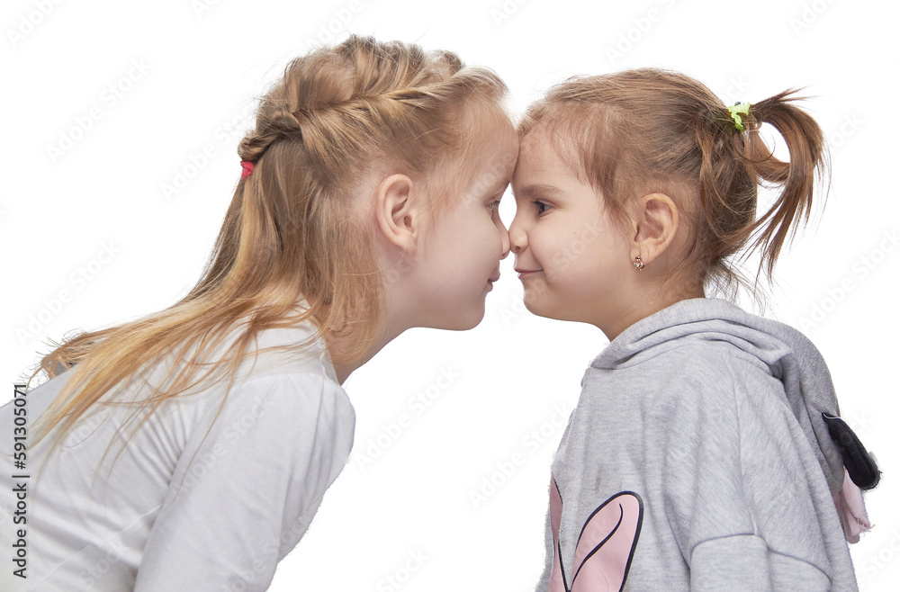Little girls happily play in the background, posing on a homogeneous background of isolates. Little girls happily play in the background, posing on a homogeneous background of isolates.