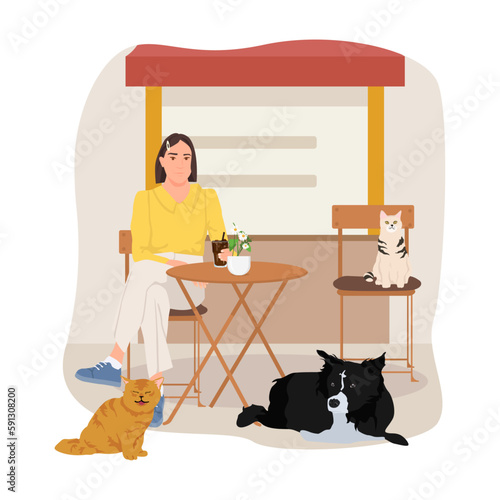 Stray animals and woman sitting in cafe.