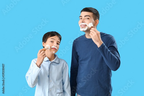 Man and his little son appl...