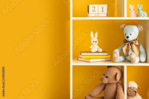 Bookshelf with baby toys ne...