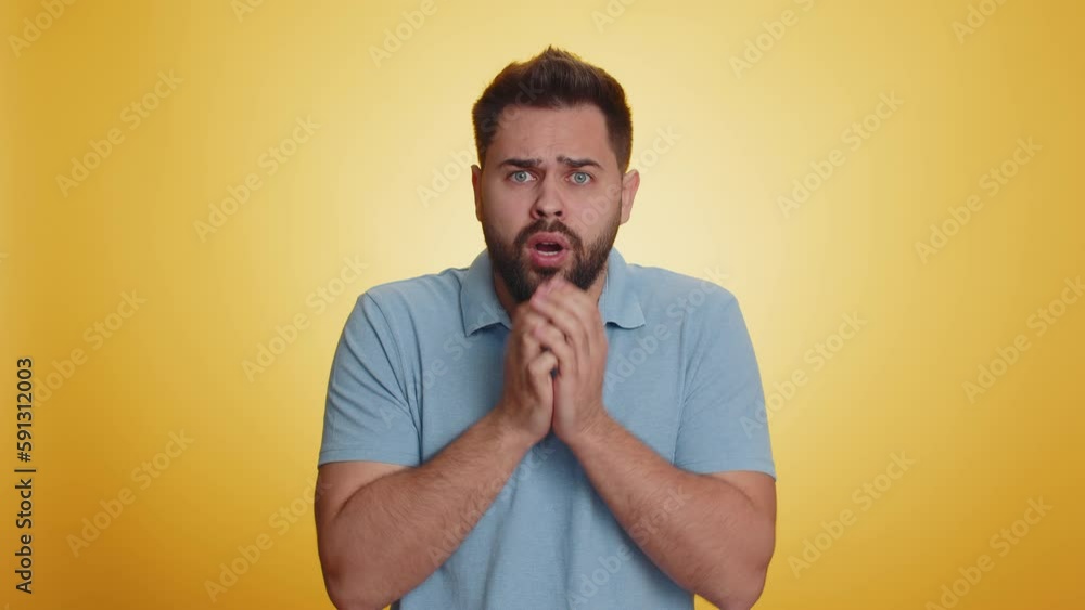 Stressed depressed caucasian man terrified about danger problems, suffering phobia, anxiety disorder, expresses fear, waving no, insecure, stress, panic. Young guy isolated on yellow studio background Stressed depressed caucasian man terrified about danger problems, suffering phobia, anxiety disorder, expresses fear, waving no, insecure, stress, panic. Young guy isolated on yellow studio background