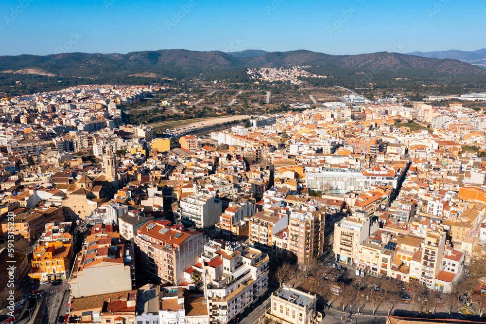 Aerial photo of Spanish town El Vendrell with view of residential buildings and skyline.