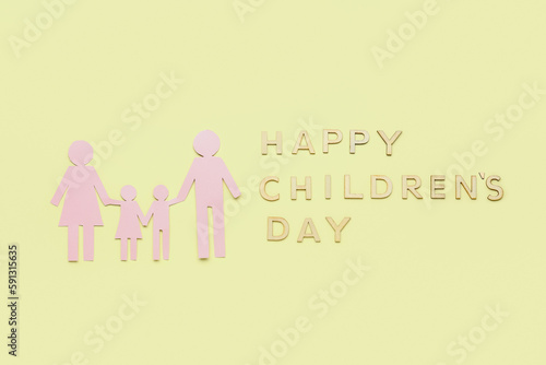 Text HAPPY CHILDREN'S DAY with family figure on yellow background