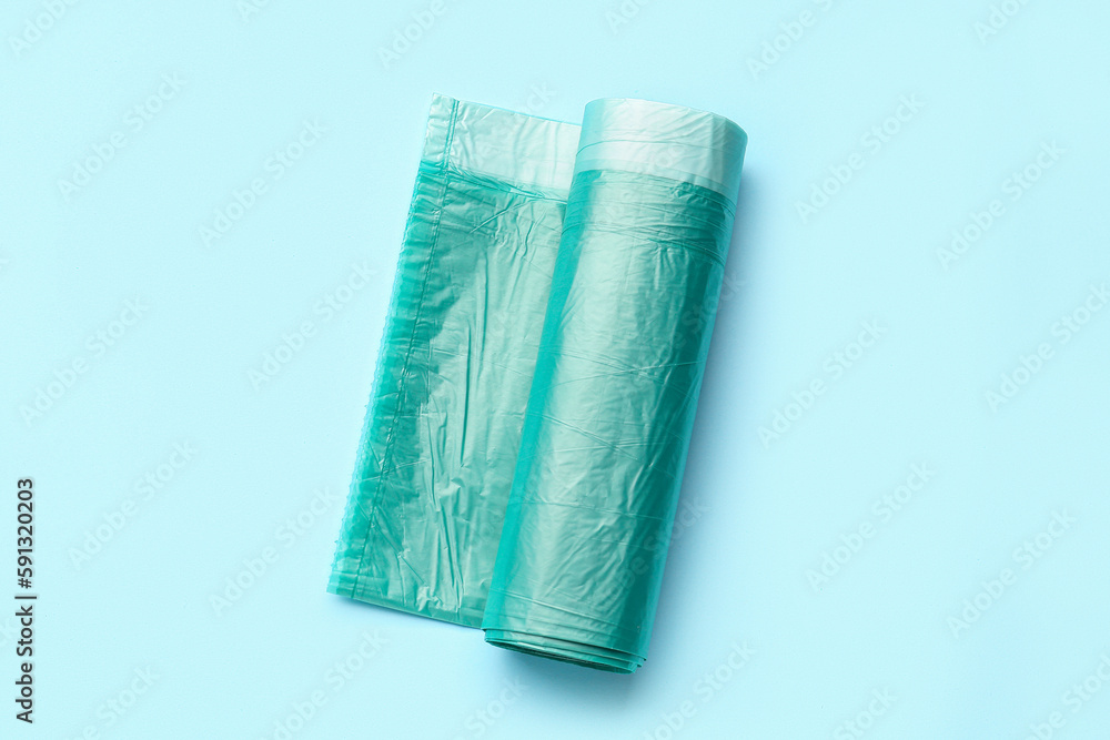 Roll of garbage bags on blue background Roll of garbage bags on blue background