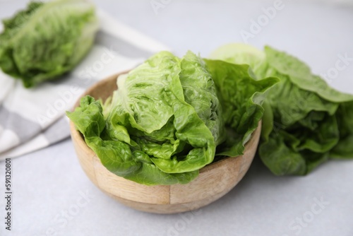 Fresh green romaine lettuces on grey table