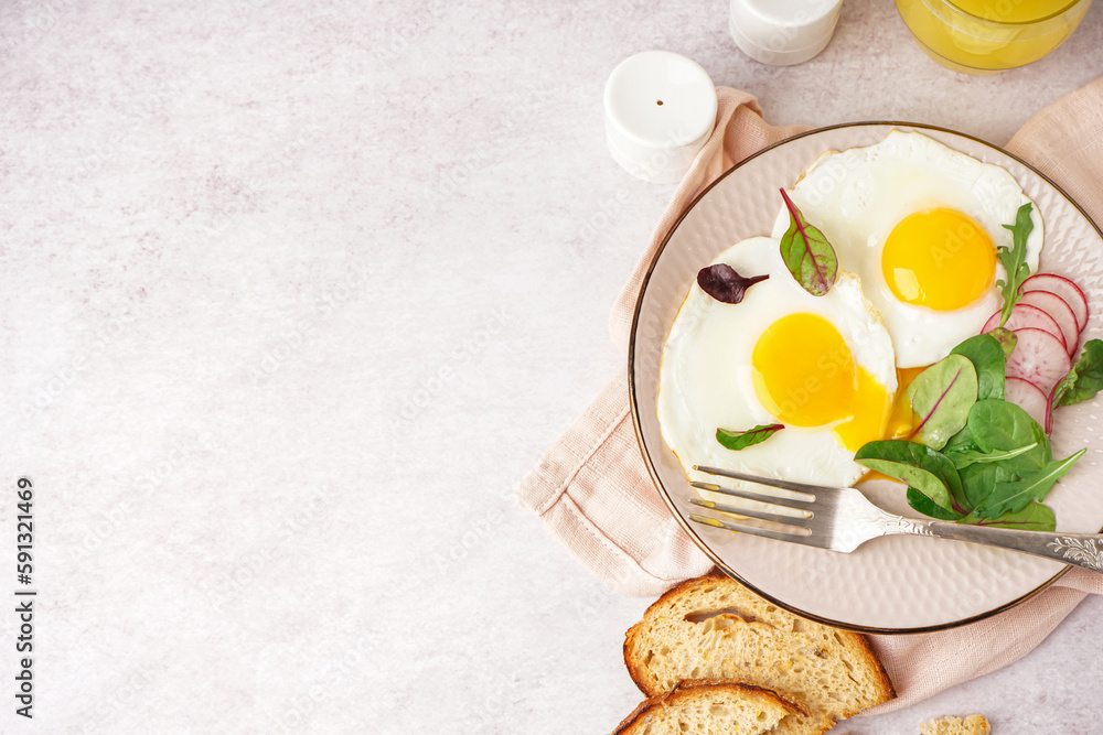 Plate with tasty fried egg, radish and spinach on light background Plate with tasty fried egg, radish and spinach on light background