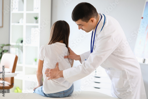 Doctor checking posture of ...