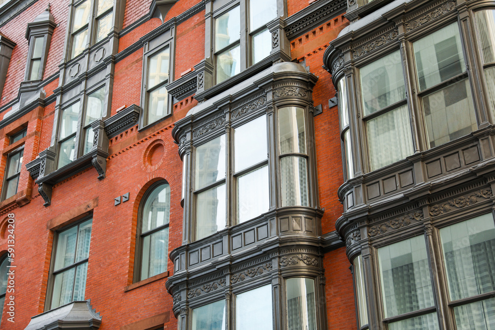 city brick buildings can symbolize urbanization, industrialization, and