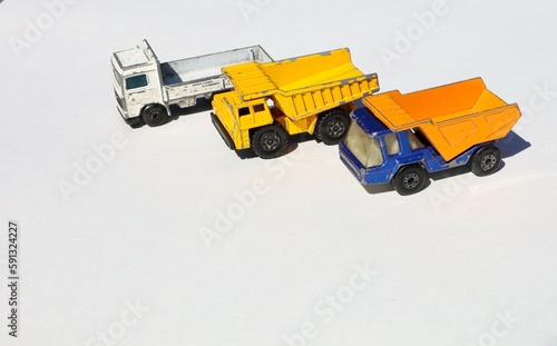 Three Miniature, Heavy-Duty Construction Trucks