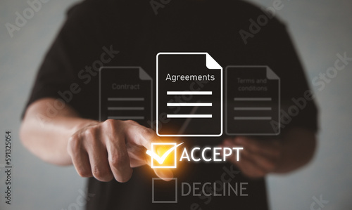 Man accepts agreements, contact, terms and conditions doument of business or online service. photo