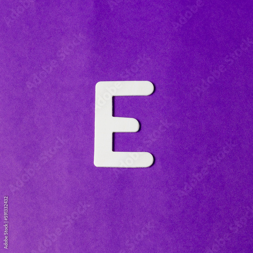 Uppercase letter E - wood texture - Purple background