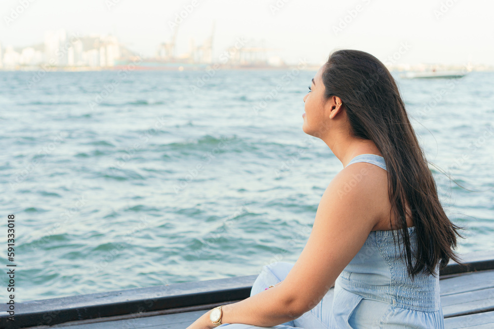 Woman pensive during a beautiful summer day.