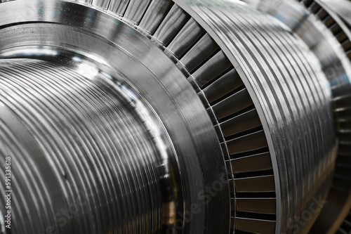 Shiny blades of high-speed steam turbine in workshop