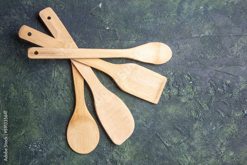 top view wooden utencils on dark background knife kitchen dinner wood color food table meal photo