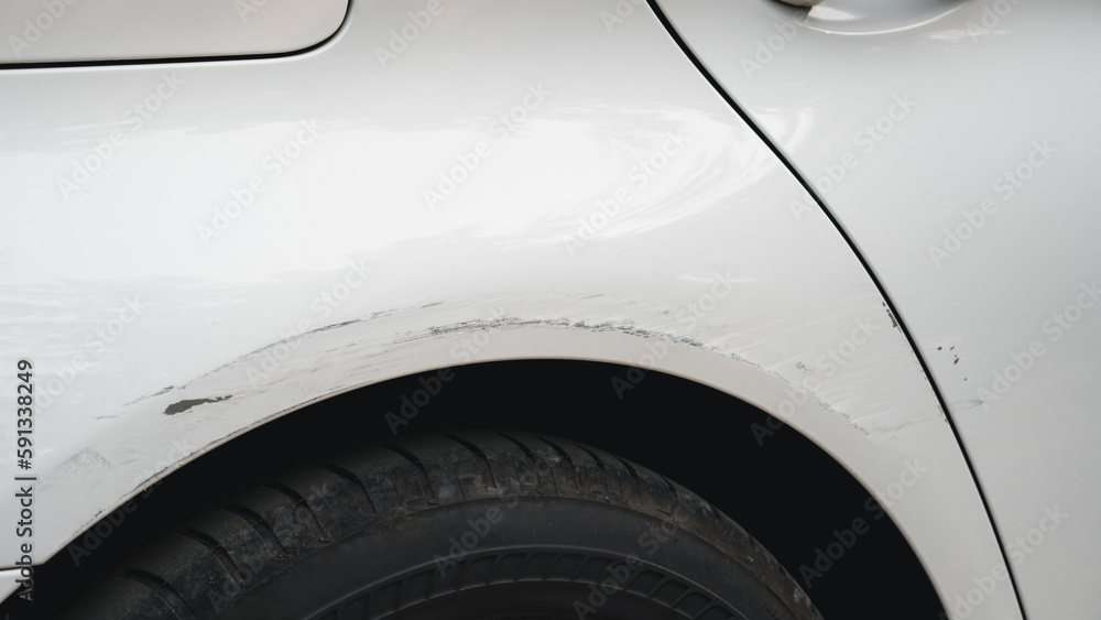 Deep scratches and paint damage on a bumper vehicle. car scratch and dent. accident involving a car crash