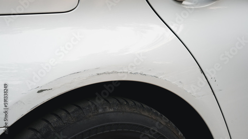 Deep scratches and paint damage on a bumper vehicle. car scratch and dent. accident involving a car crash