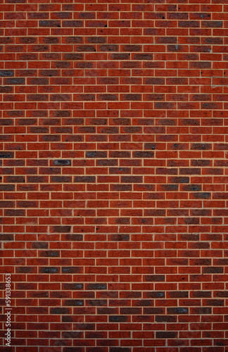 detail of a high red brick wall 