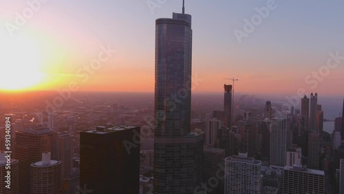 Beautiful shot of the chicago skyline with a vibrant summer sunset. Glazing over the city of chicago with the beautiful towering presence photo