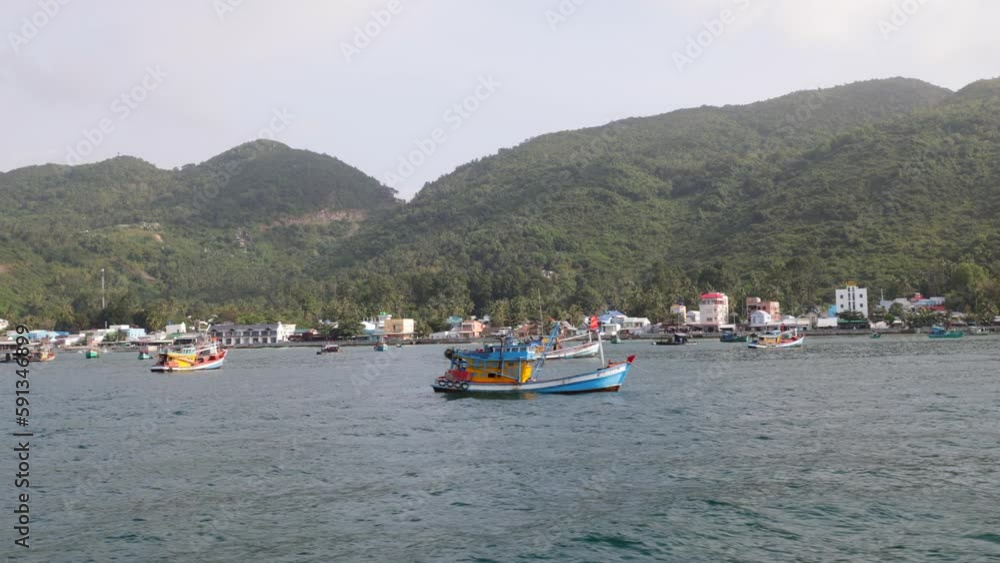 Fisherman's Trawler Boats Moored at Public Ferry Docking at Hon Son Island in Gulf of Thailand in Vietnam Fisherman's Trawler Boats Moored at Public Ferry Docking at Hon Son Island in Gulf of Thailand in Vietnam
