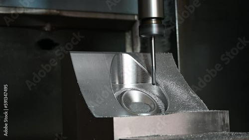 The CNC milling machine cutting press die part by solid ball end mill tool.