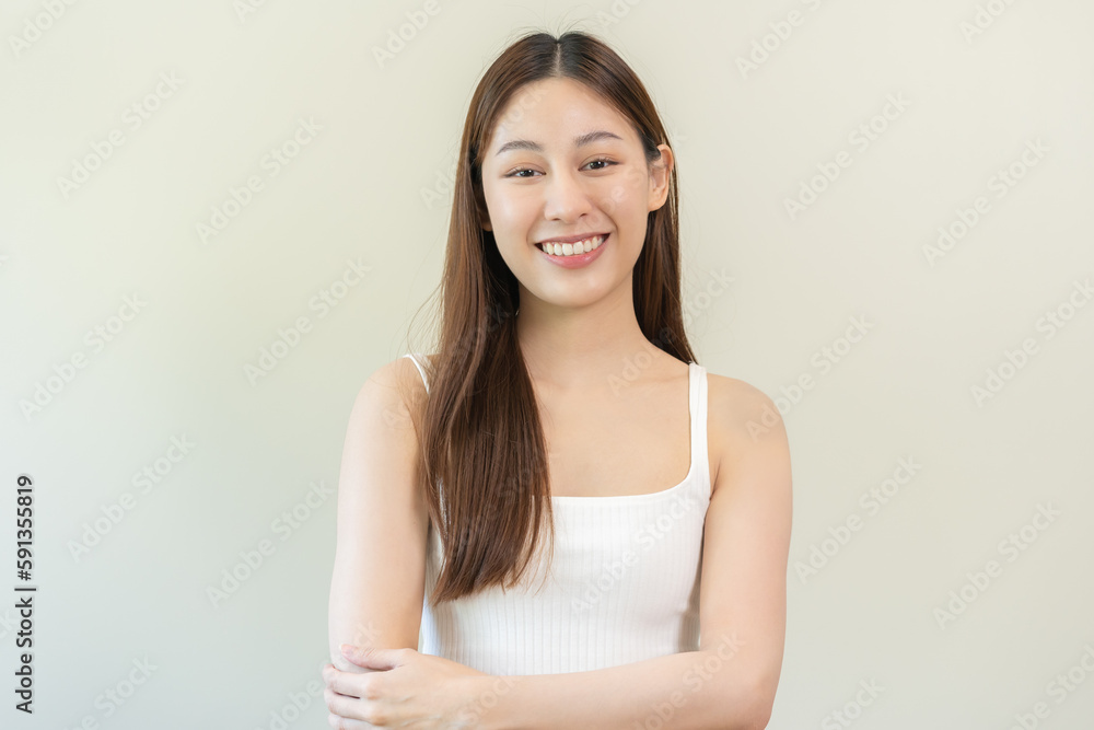 Smiling positive, attractive asian young woman wearing casual cloth, portrait of beautiful brunette her with long brown hair, feeling happy looking to camera standing isolated on white background. Smiling positive, attractive asian young woman wearing casual cloth, portrait of beautiful brunette her with long brown hair, feeling happy looking to camera standing isolated on white background.
