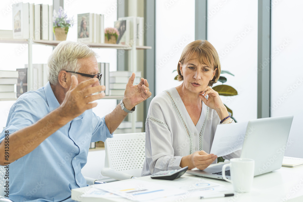Obraz premium Stressed husband, wife senior couple elderly family, caucasian mature, retired calculate budget from invoice, expense or bill, no money to pay. Mortgage, loan causing debt, bankruptcy of financial.