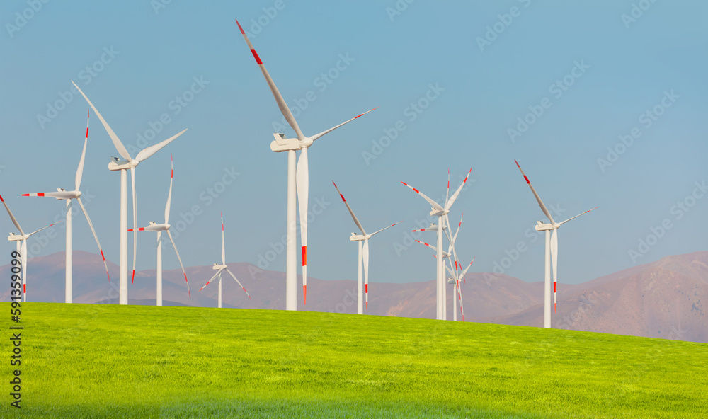 Wind turbines generating electricity with bright blue sky