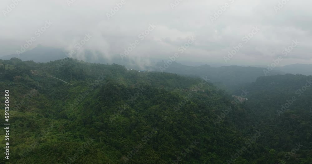 Tropical mountain range and mountain slopes with rainforest. Sumatra, Indonesia. Tropical mountain range and mountain slopes with rainforest. Sumatra, Indonesia.