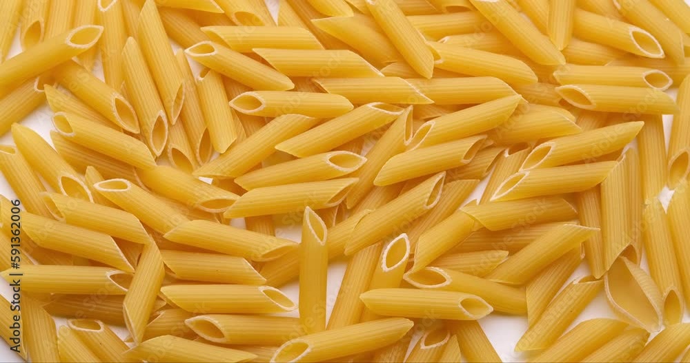 pasta backgroud - macro view of Dry Authentic Italian penne pasta backgroud - macro view of Dry Authentic Italian penne