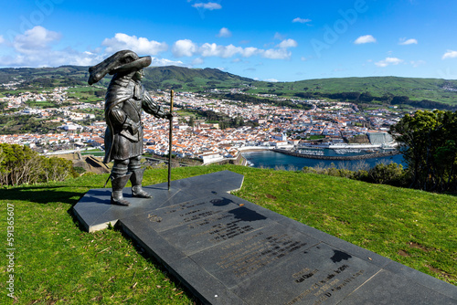 View of the city of Angra do Heroismo. Statue of D. Afonso VI, on Mount Brazil. Historic fortified city and the capital of the Portuguese island of Terceira. Azores. Portugal.