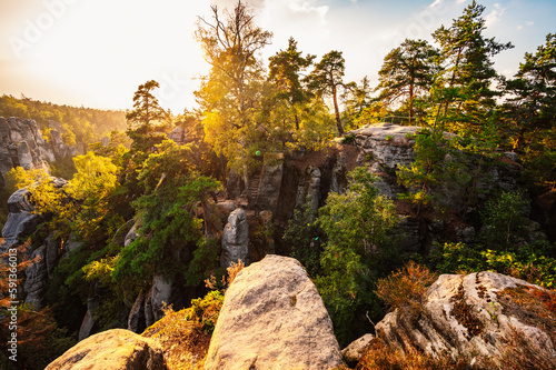 Cesky raj sandstone cliffs - Prachovske skaly in summer sunset, Czech Republic. Rock labyrinth is tourist attraction in Bohemian Paradise, Czech Republic photo