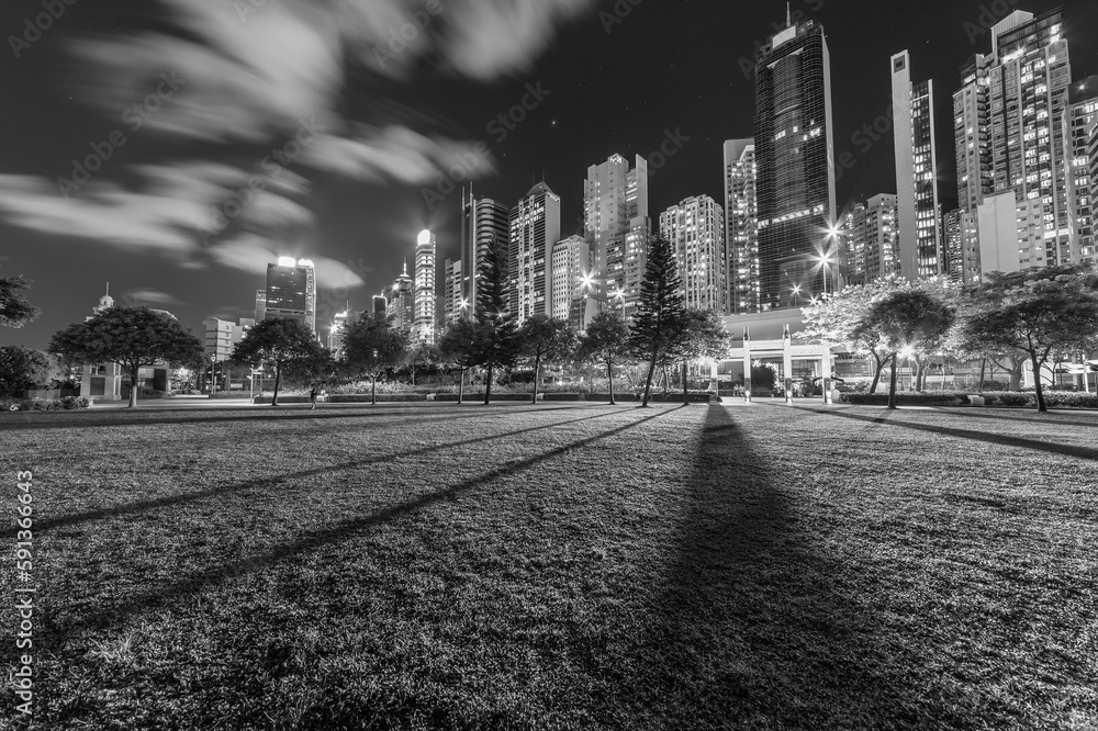 Fototapeta premium High rise office building and public park in downtown of Hong Kong city at night