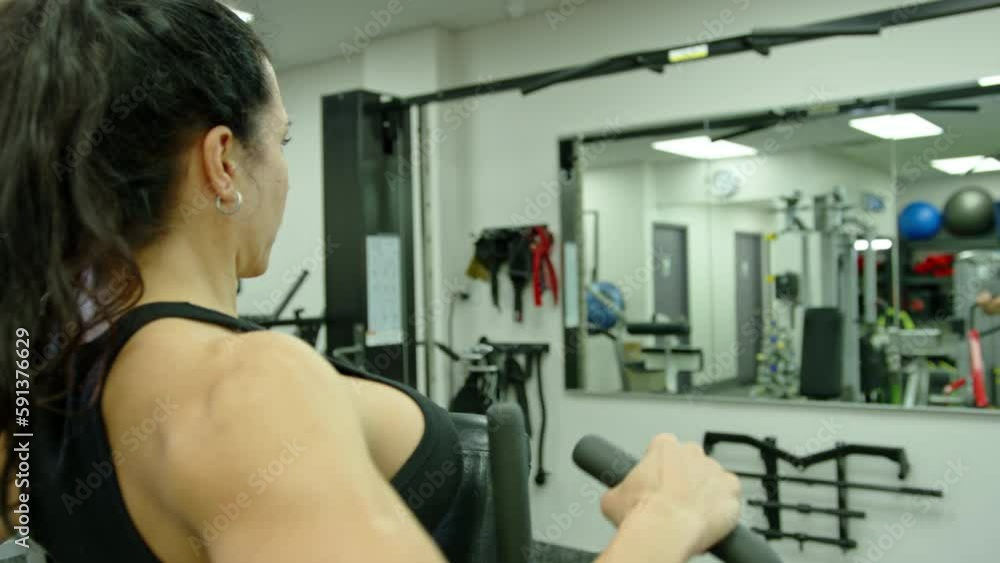 Young fitness woman make exercise in gym Young fitness woman make exercise in gym